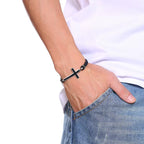 Sideways cross bracelet on braided leather cord – view 2
