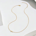Dainty sideways cross necklace in gold or silver – view 4