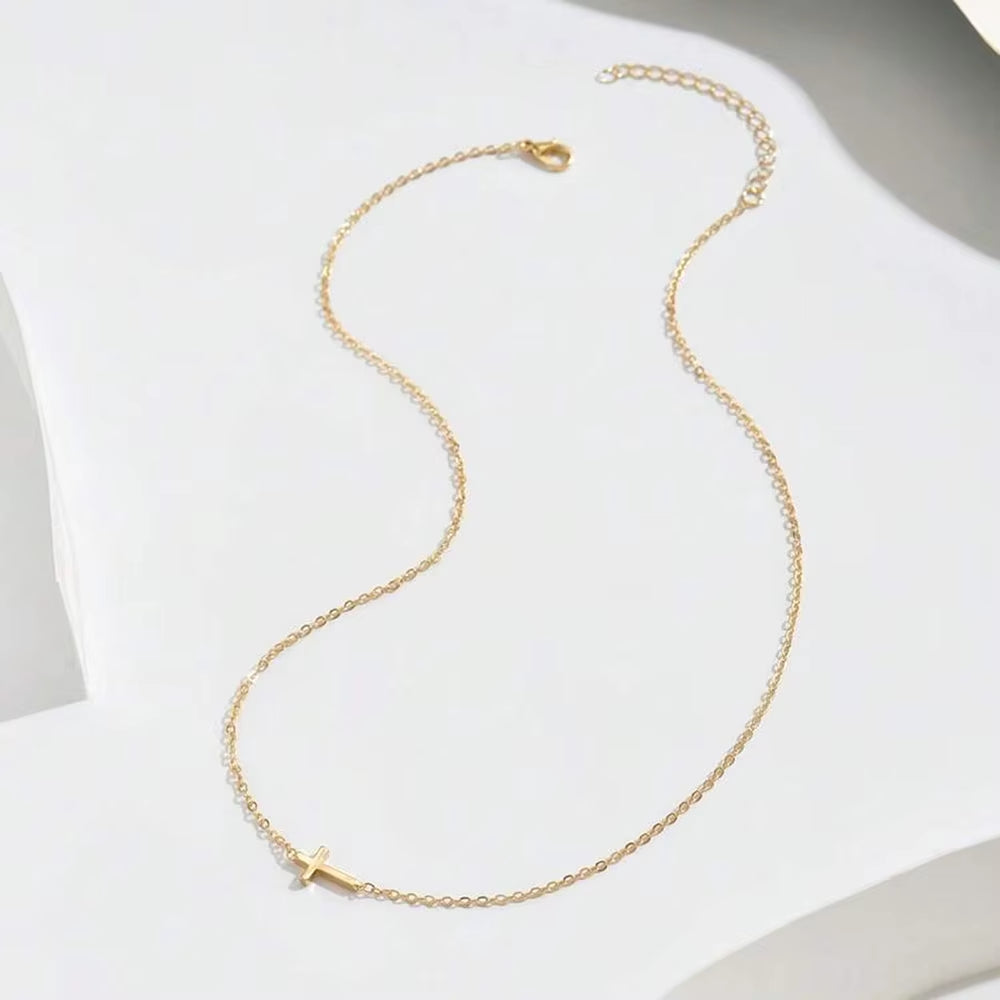 Dainty sideways cross necklace in gold or silver – view 4